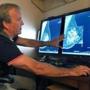Radiologist Dr. Paul Bice compared an image from earlier, 2-D technology mammogram to the new 3-D Digital Breast Tomosynthesis mammography in Wichita Falls, Texas, in 2012.